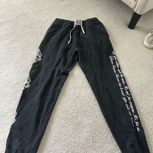 Darc Sport Black Sweatpants with White Script and Floral Accents